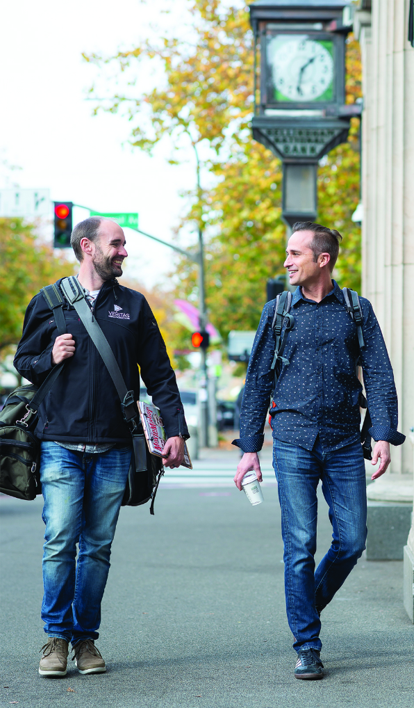 Two men walking down the street